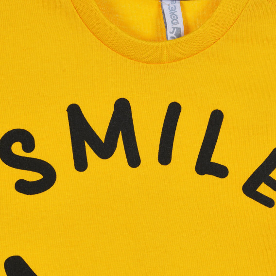 Βαμβακερό μπλουζάκι με τη λεζάντα Smile για ένα μωρό, κίτρινο Idexe 239338 2