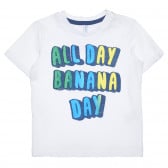 Βαμβακερό μπλουζάκι με τη λεζάντα All Day Banana Day για ένα μωρό, λευκό Idexe 239416 