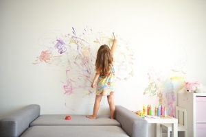 Curly,cute,little,toddler,girl,painting,with,paints,color,and