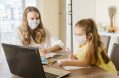 Student,girl,and,teacher,with,medical,mask,on,face,at