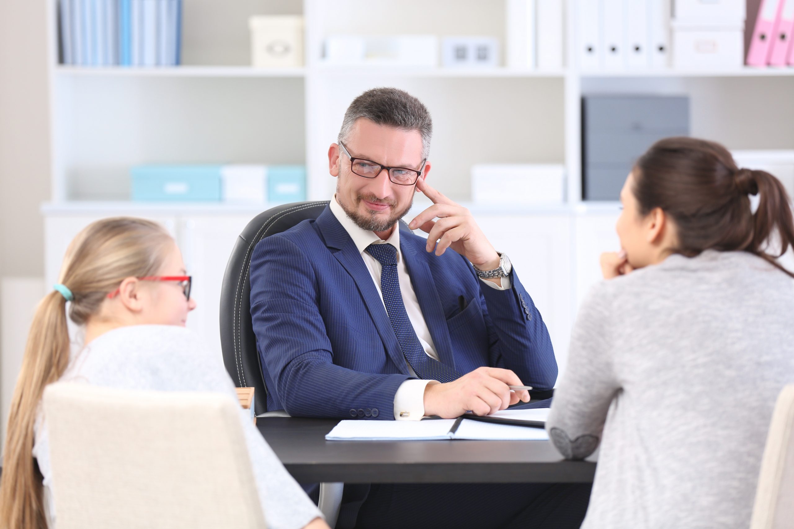 young,woman,with,daughter,during,teacher parent,meeting,at,school