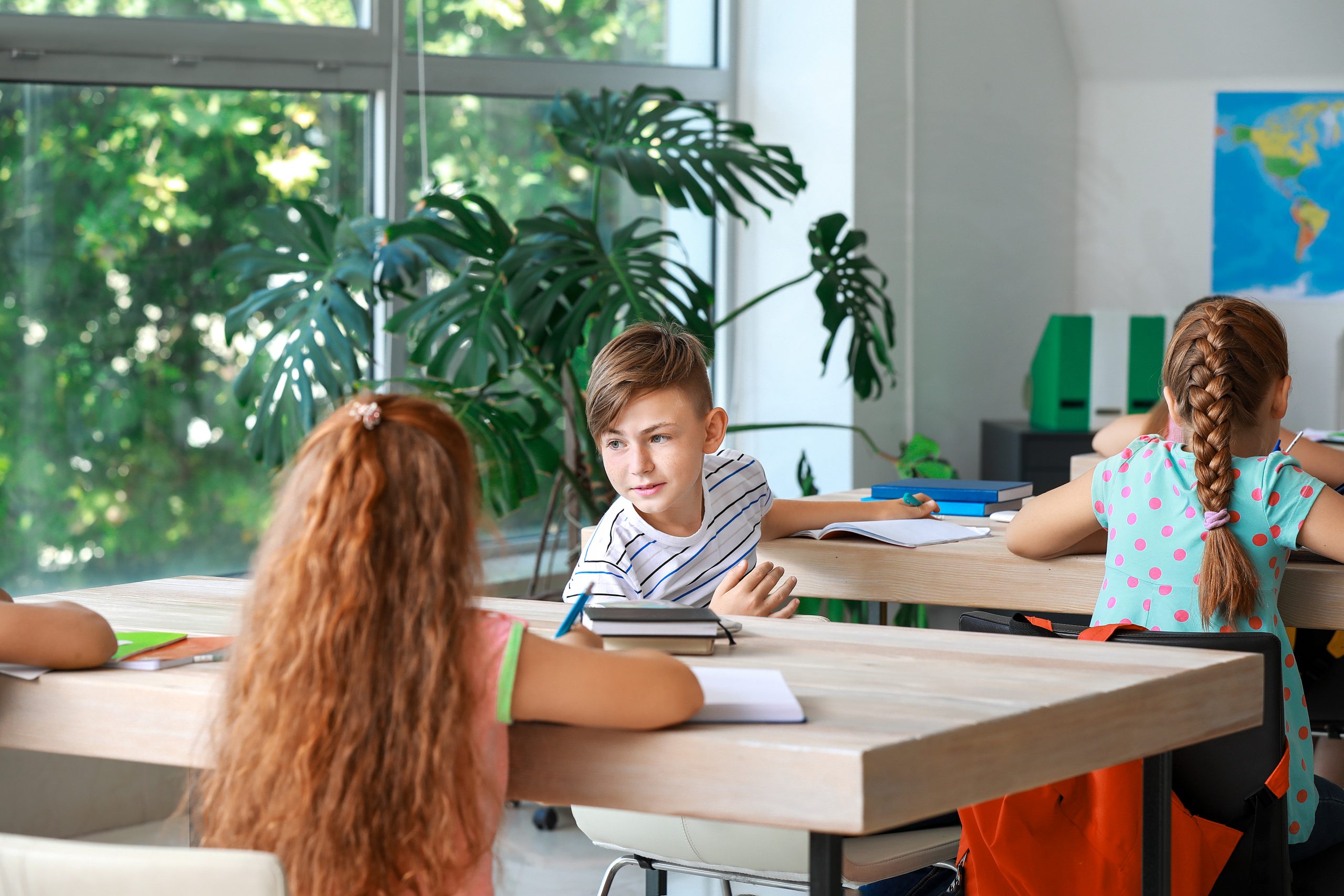 cute,little,pupils,during,lesson,in,classroom