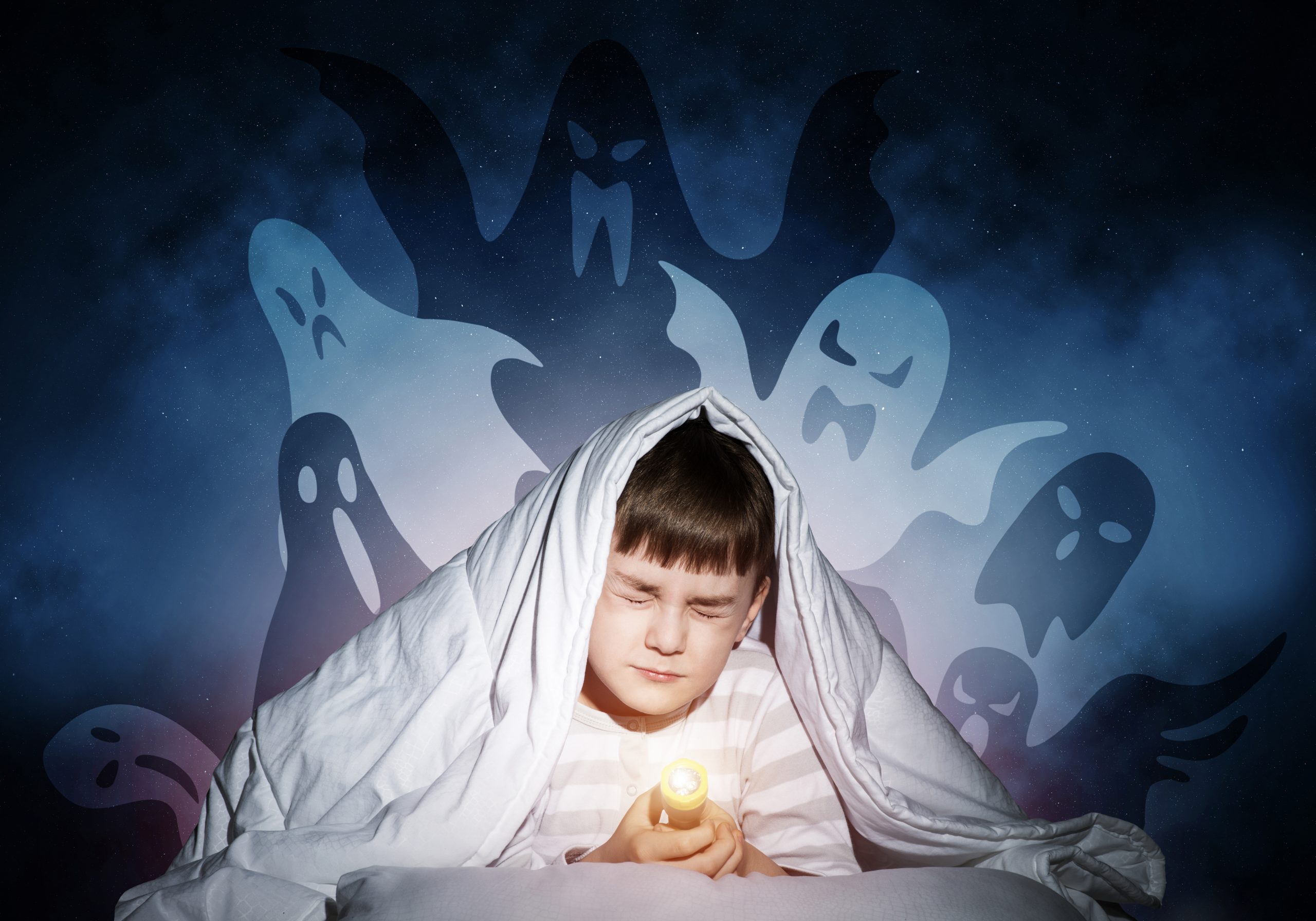 young,boy,hiding,under,blanket,from,imaginary,ghosts.,scared,kid