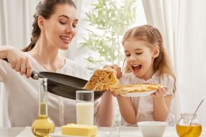 mother,and,daughter,prepare,pancakes