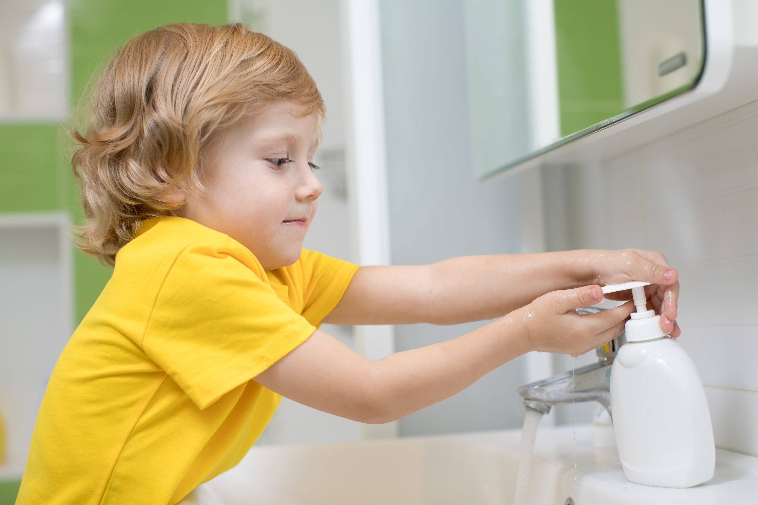 cute,kid,boy,washing,his,hands,in,bathroom