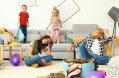 frustrated,parents,and,their,mischievous,children,in,messy,room