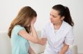 female,doctor,in,labcoat,comforting,patient,crying,in,hospital