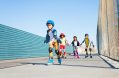 boy,playing,roller,skates,with,friends,outdoors